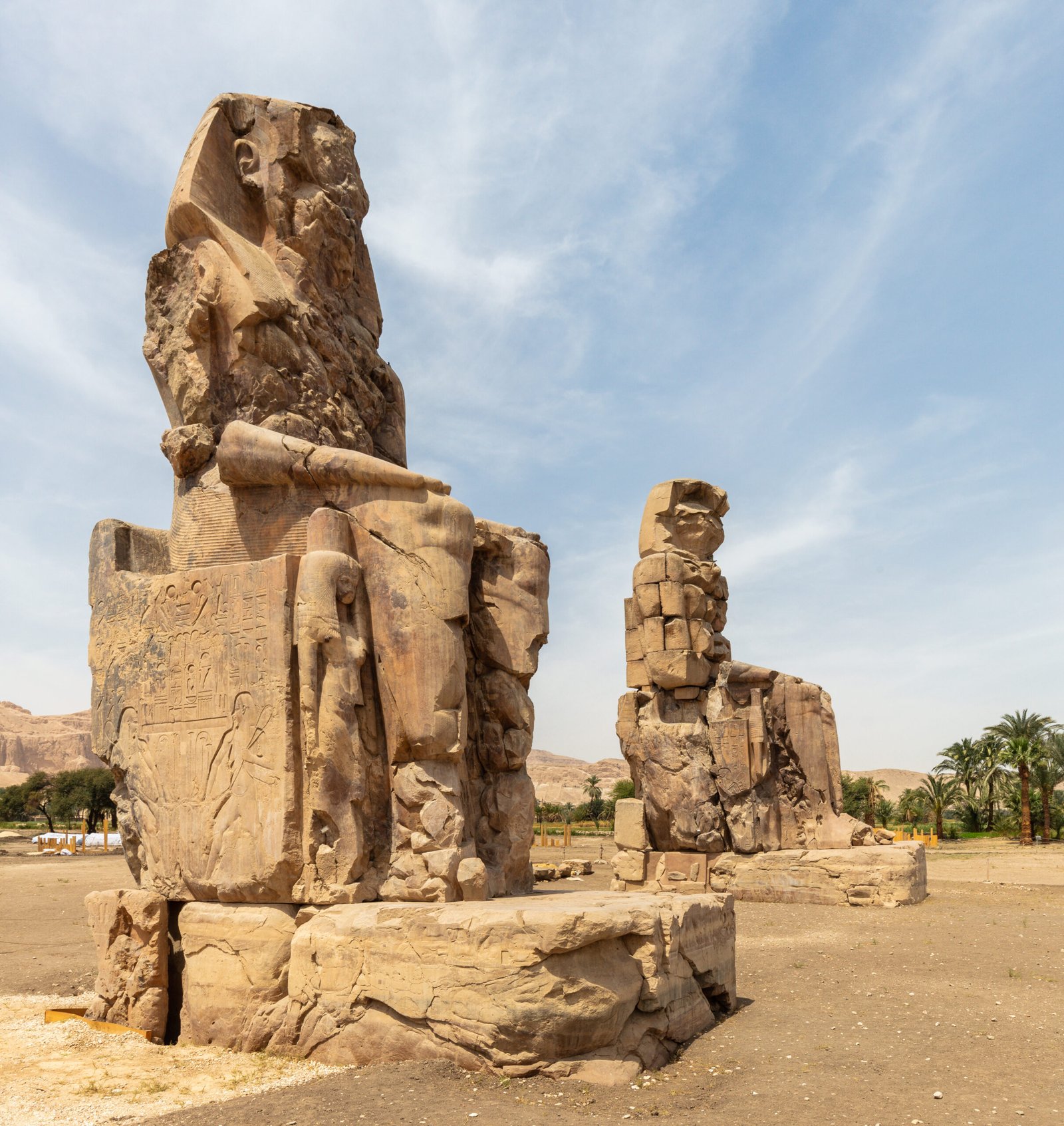 Colossi of Memnon at the ruined mortuary temple of Amenhotep III