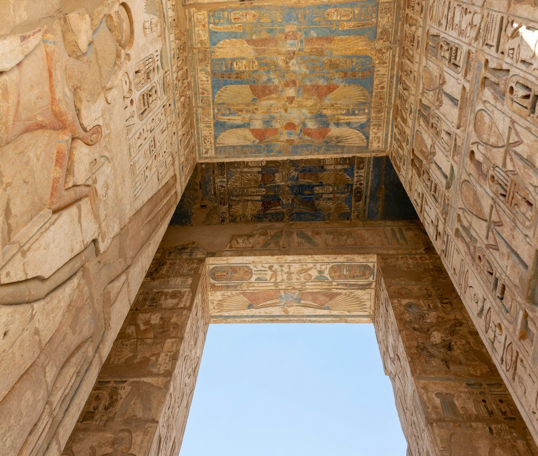 Large stone gateway covered with hieroglyphic carvings at Medinet Habu, Luxor